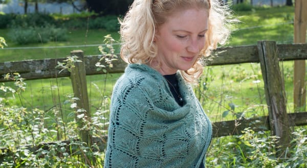 Wrapped in green wool shawl