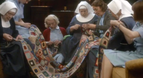 Nuns and midwives sewing a blanket