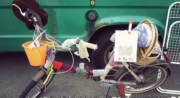 Yarn bombed bike wrapped in wool