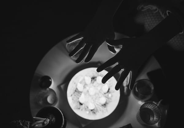 Hands over burning candles