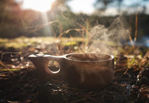 Steaming tea in wooden cup