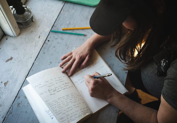 Woman writing in guestbook