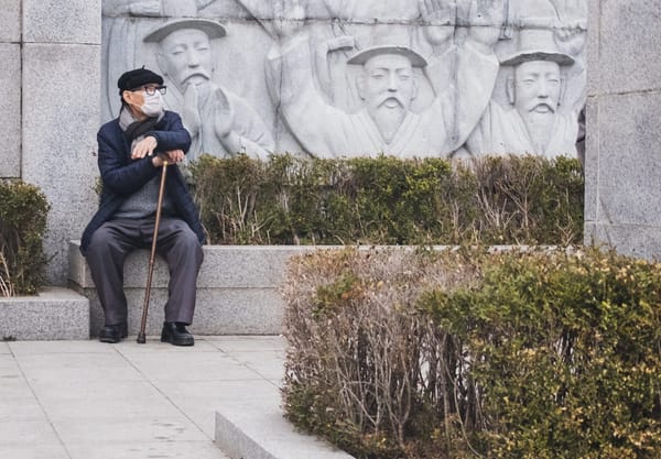 Man sitting on a wall