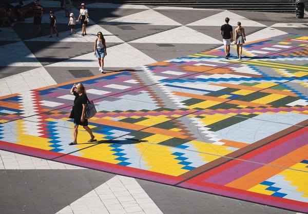 People walking on colourful floor