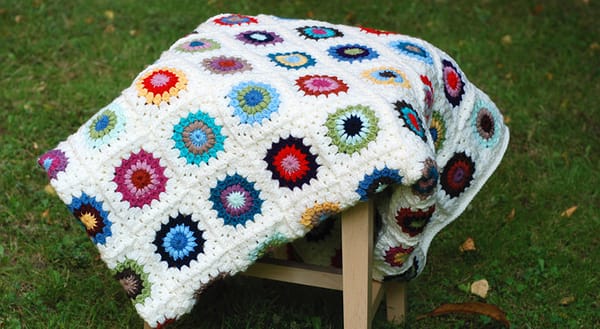 Multicoloured round granny square blanket