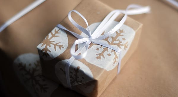 Brown snowflake wrapping with white ribbon