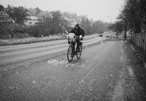 Man cycling in the snow