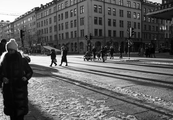 Sun shining on snowy street