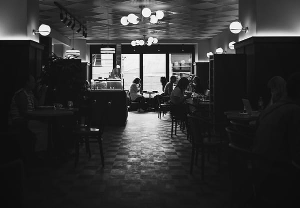 Window at the end of a dimly lit café