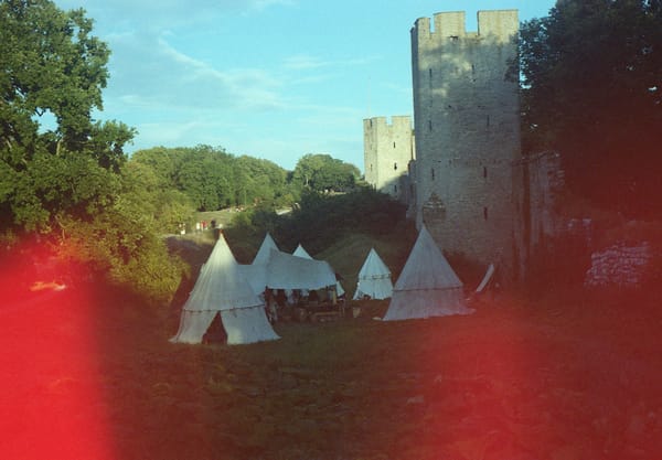 Medieval tents next to ruins