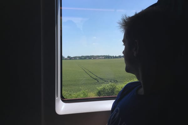 Man looking out of window
