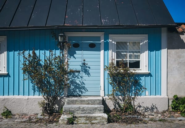 Old wooden house with small door